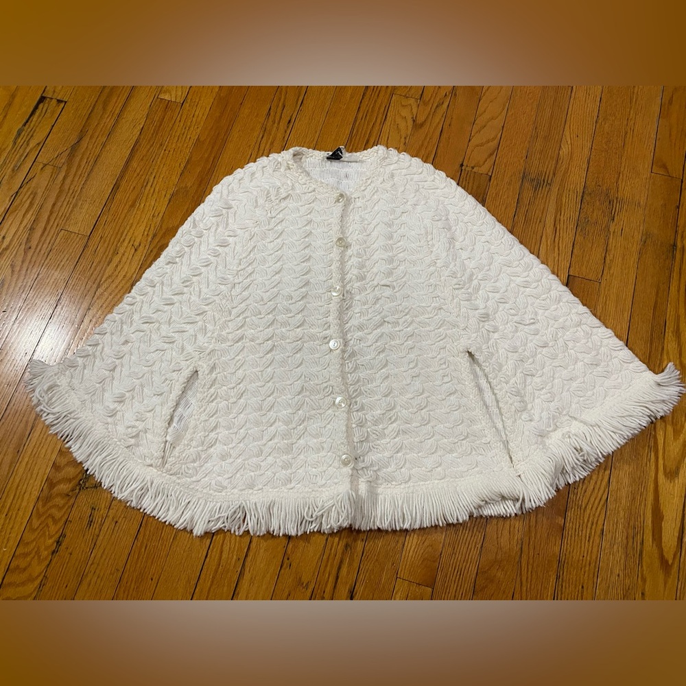 Knit poncho with arm holes by Arista